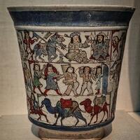 Mina'i beaker with narrative scenes, Freer