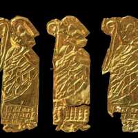 Gold-foil figures with a curved staff, from Västra Vång, Sweden