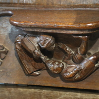 Fairford parish church, misericord with hair puller